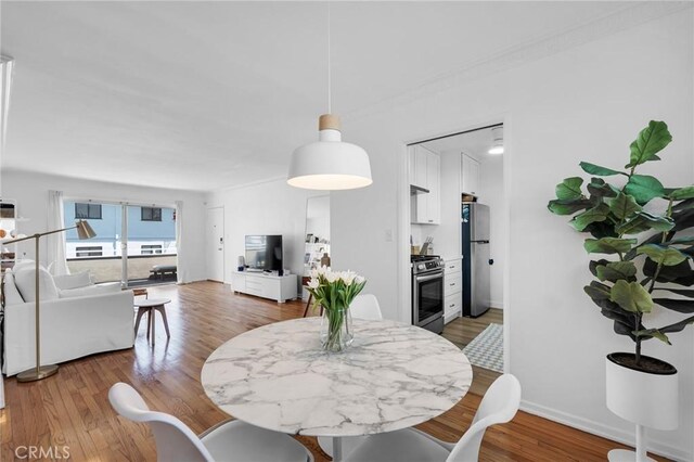 1330 N Crescent Heights Blvd Unit 12, West Hollywood, CA 90046 - dining area with wood finished floors and baseboards