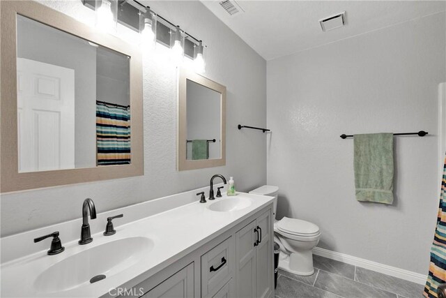 18064 Cajon St, Hesperia, CA 92345 - full bathroom with double vanity, toilet, a shower with curtain, baseboards, and tile patterned flooring