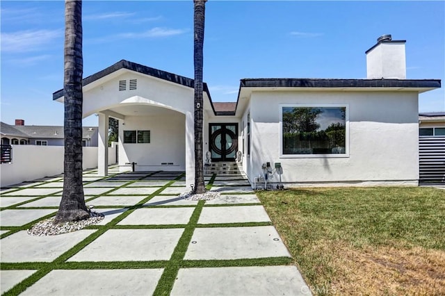9743 Monogram Ave, Northridge, CA 91343 - view of front of house featuring a chimney and stucco siding