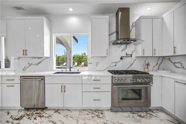 9743 Monogram Ave, Northridge, CA 91343 - kitchen with stainless steel appliances, a sink, wall chimney range hood, light marble finish floors, and recessed lighting