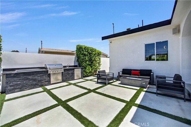 9743 Monogram Ave, Northridge, CA 91343 - view of patio with outdoor lounge area and a sink
