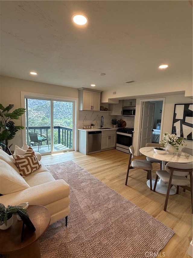 2838 Lambert Dr, Los Angeles, CA 90068 - living room featuring light wood-type flooring and recessed lighting