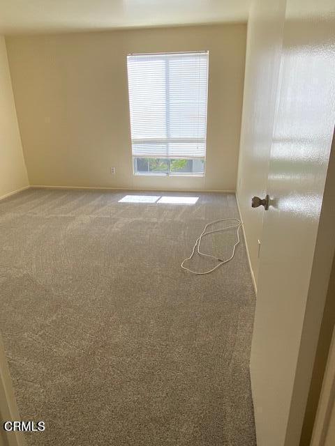 330 S Mentor Ave Unit 233, Pasadena, CA 91106 - unfurnished room featuring light colored carpet and baseboards