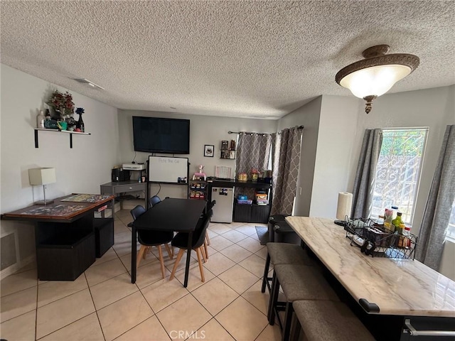 2651 Annapolis Cir, San Bernardino, CA 92408 - dining space with light tile patterned floors and a textured ceiling