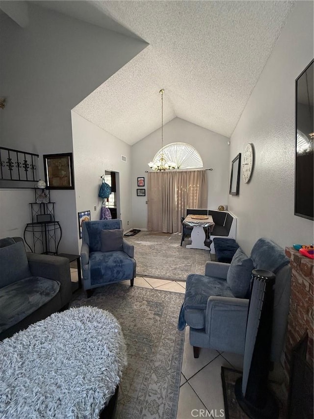 2651 Annapolis Cir, San Bernardino, CA 92408 - tiled living room with vaulted ceiling, a textured ceiling, and a chandelier
