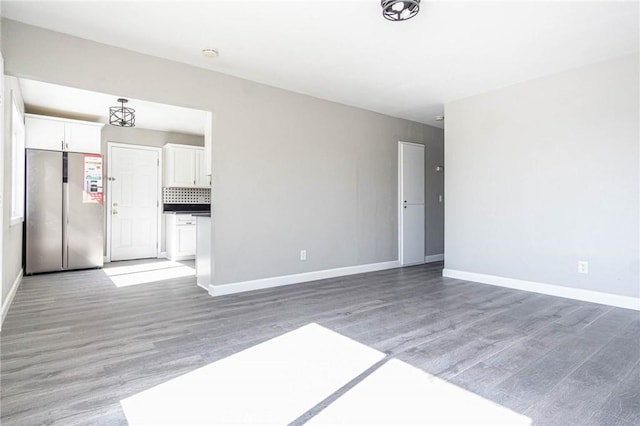 2008 Sequoia Dr, Barstow, CA 92311 - unfurnished living room featuring light wood-type flooring and baseboards