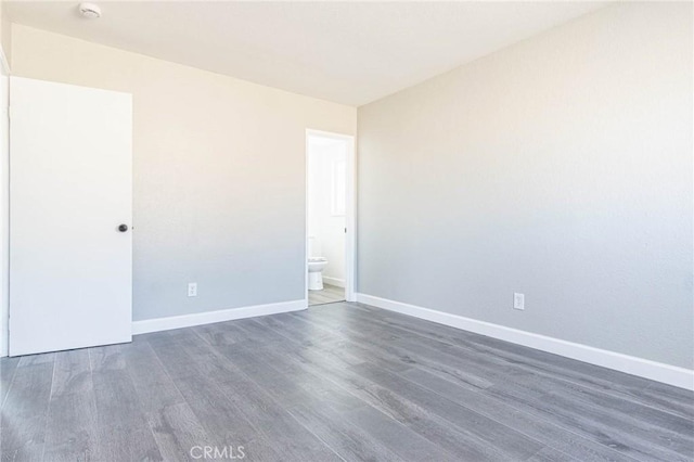 2008 Sequoia Dr, Barstow, CA 92311 - spare room with wood finished floors, baseboards, and a smoke detector