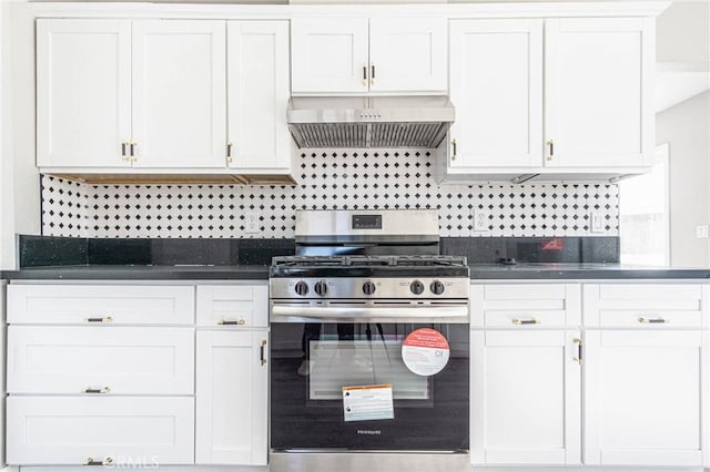 2008 Sequoia Dr, Barstow, CA 92311 - kitchen with gas stove, premium range hood, dark countertops, tasteful backsplash, and white cabinets