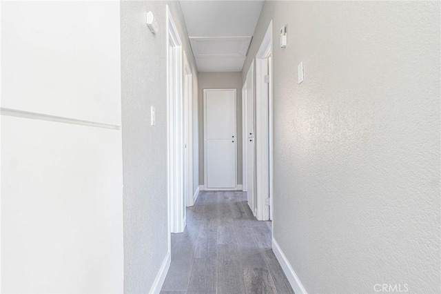 2008 Sequoia Dr, Barstow, CA 92311 - hall with wood finished floors, baseboards, and a textured wall