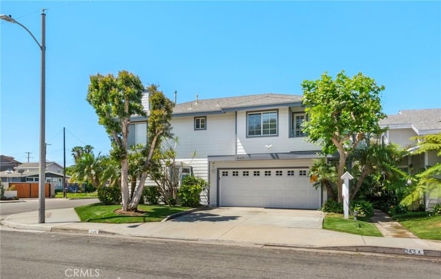 245 Palmer St, Costa Mesa, CA 92627 - view of front of home with concrete driveway and a garage