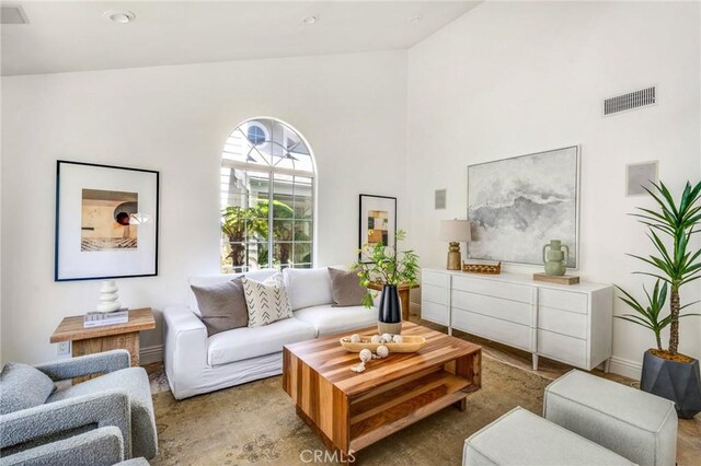 245 Palmer St, Costa Mesa, CA 92627 - living area featuring high vaulted ceiling and baseboards