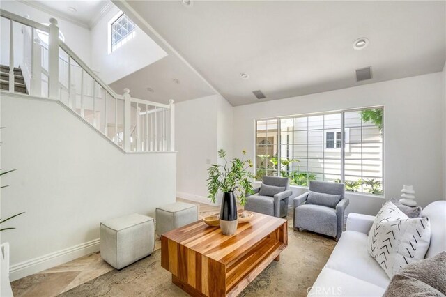245 Palmer St, Costa Mesa, CA 92627 - living room featuring stairway, baseboards, and ornamental molding