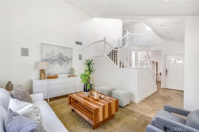 245 Palmer St, Costa Mesa, CA 92627 - living area with stairway, baseboards, and high vaulted ceiling