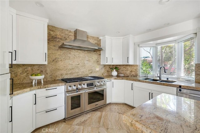 245 Palmer St, Costa Mesa, CA 92627 - kitchen with stainless steel appliances, wall chimney exhaust hood, a sink, backsplash, and white cabinetry