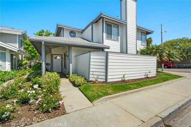 245 Palmer St, Costa Mesa, CA 92627 - view of front of house with a chimney