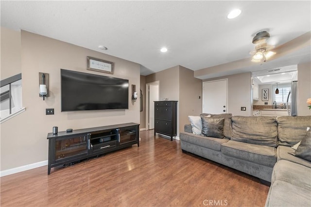 8288 Mondavi Pl, Rancho Cucamonga, CA 91730 - living area featuring wood finished floors, baseboards, ceiling fan, and recessed lighting