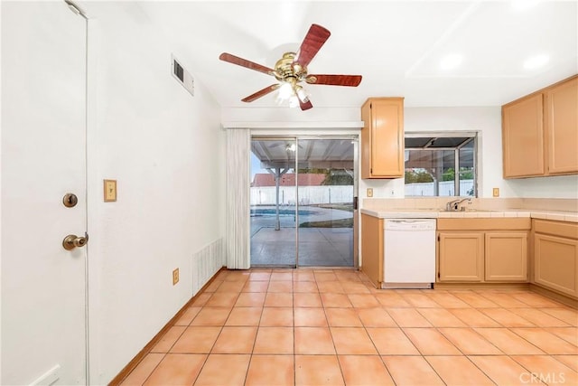 37538 Stonegate Ln, Palmdale, CA 93552 - kitchen with white dishwasher, tile counters, a ceiling fan, light tile patterned floors, and a sink