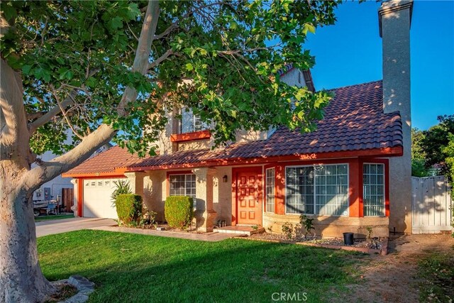 37538 Stonegate Ln, Palmdale, CA 93552 - view of front facade featuring a tiled roof, a garage, a chimney, driveway, and stucco siding