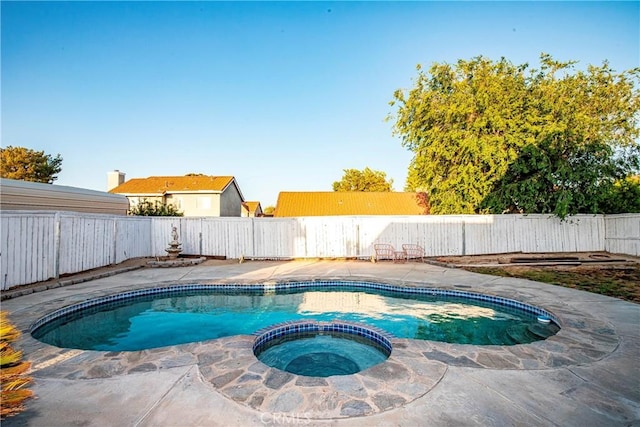 37538 Stonegate Ln, Palmdale, CA 93552 - view of swimming pool featuring a pool with connected hot tub, a fenced backyard, and a patio area