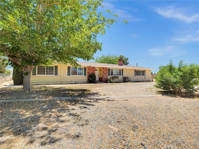 20715 Teton Rd, Apple Valley, CA 92308 - single story home featuring a chimney and brick siding
