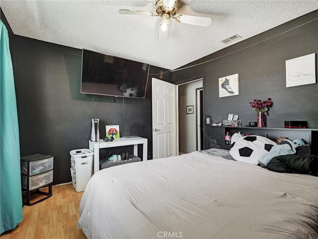 20715 Teton Rd, Apple Valley, CA 92308 - bedroom with wood finished floors, a textured ceiling, and a ceiling fan