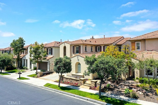 53 Via Armilla, San Clemente, CA 92673 - mediterranean / spanish-style house featuring stucco siding, a tiled roof, a residential view, driveway, and an attached garage