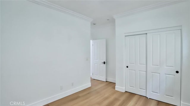 53 Via Armilla, San Clemente, CA 92673 - unfurnished bedroom featuring crown molding, light wood finished floors, and a closet