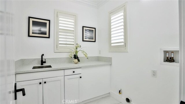 53 Via Armilla, San Clemente, CA 92673 - laundry room featuring washer hookup, marble finish floors, cabinet space, baseboards, and ornamental molding