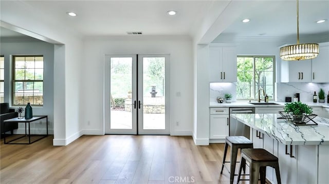 53 Via Armilla, San Clemente, CA 92673 - doorway to outside featuring a sink, healthy amount of natural light, french doors, light wood-type flooring, and ornamental molding