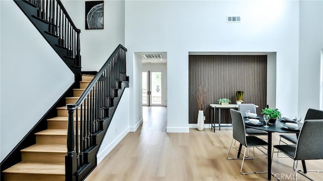 53 Via Armilla, San Clemente, CA 92673 - dining space featuring a high ceiling, wood finished floors, stairway, and baseboards