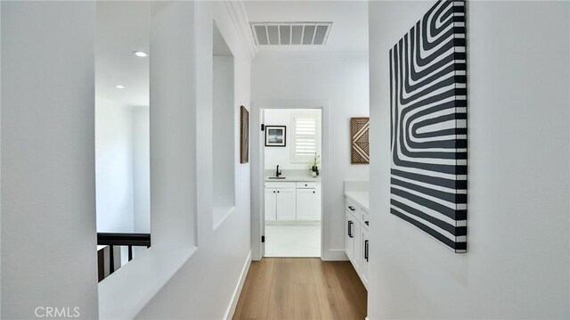 53 Via Armilla, San Clemente, CA 92673 - corridor featuring a sink and wood finished floors