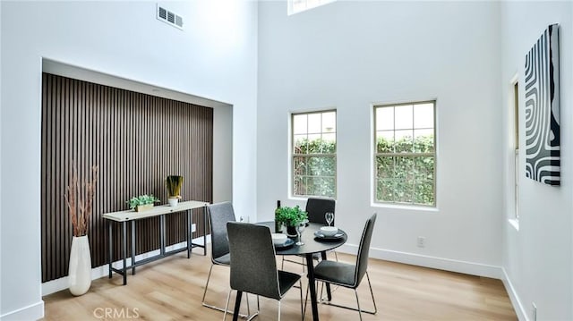 53 Via Armilla, San Clemente, CA 92673 - dining area featuring light wood finished floors, plenty of natural light, baseboards, and a high ceiling