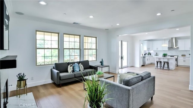 53 Via Armilla, San Clemente, CA 92673 - living room featuring light wood finished floors, baseboards, recessed lighting, and ornamental molding