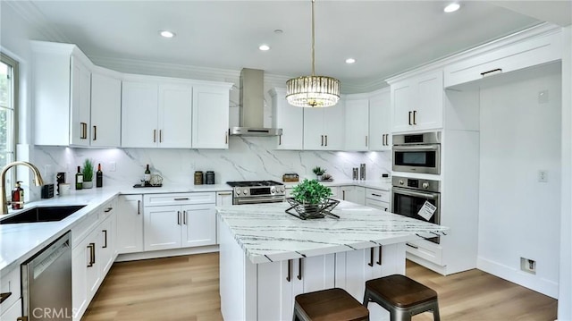 53 Via Armilla, San Clemente, CA 92673 - kitchen with wall chimney range hood, stainless steel appliances, tasteful backsplash, light wood-style flooring, and recessed lighting