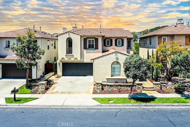 53 Via Armilla, San Clemente, CA 92673 - mediterranean / spanish-style house with an attached garage, driveway, stucco siding, a tile roof, and a residential view