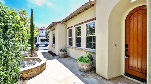 53 Via Armilla, San Clemente, CA 92673 - view of exterior entry featuring stucco siding and a patio