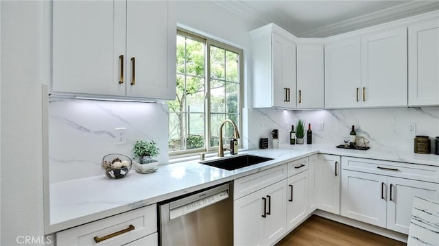 53 Via Armilla, San Clemente, CA 92673 - kitchen with stainless steel dishwasher, a sink, decorative backsplash, white cabinetry, and light stone countertops