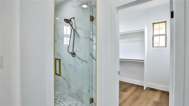 53 Via Armilla, San Clemente, CA 92673 - full bath featuring a marble finish shower, a spacious closet, and wood finished floors