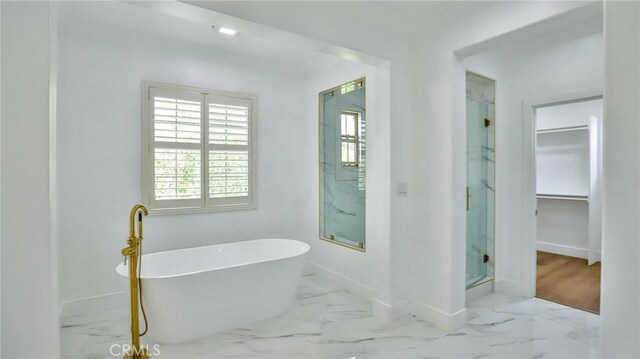 53 Via Armilla, San Clemente, CA 92673 - full bathroom with marble finish floors, a marble finish shower, a soaking tub, and a spacious closet