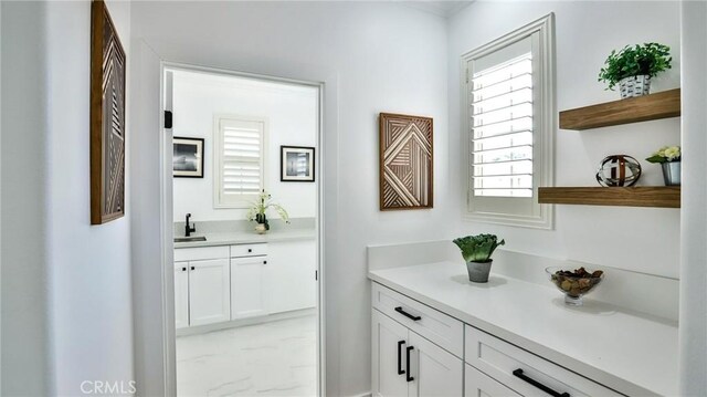 53 Via Armilla, San Clemente, CA 92673 - bar area with light marble finish floors and a sink