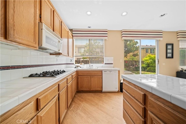 7343 Legacy Pl, Rancho Cucamonga, CA 91730 - kitchen featuring white appliances, tile countertops, light wood-type flooring, healthy amount of natural light, and recessed lighting