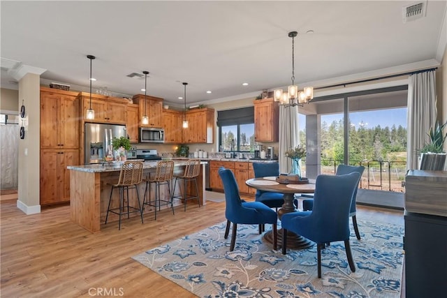 1622 Paradisewood Dr, Paradise, CA 95969 - dining room with a chandelier, recessed lighting, light wood finished floors, crown molding, and baseboards