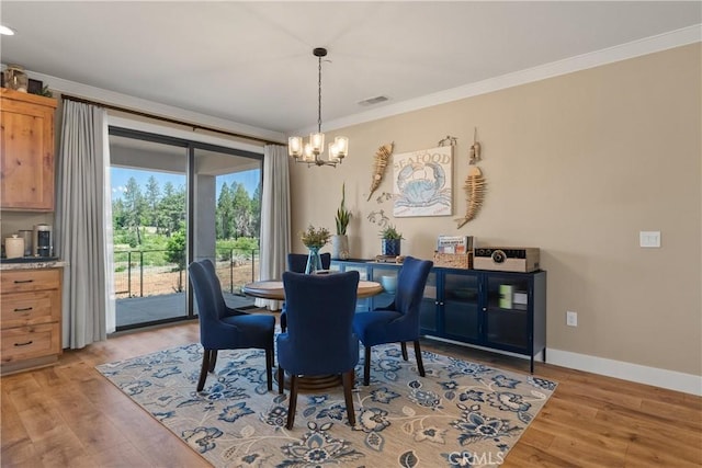 1622 Paradisewood Dr, Paradise, CA 95969 - dining area with a chandelier, ornamental molding, light wood finished floors, and baseboards
