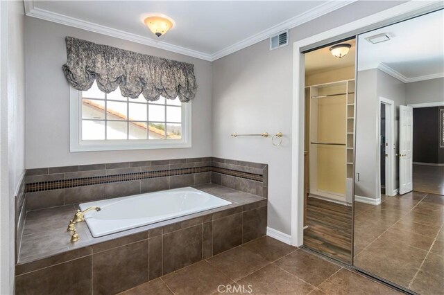 29515 Weeping Willow Dr, Agoura Hills, CA 91301 - bathroom featuring tile patterned flooring, a garden tub, crown molding, and baseboards