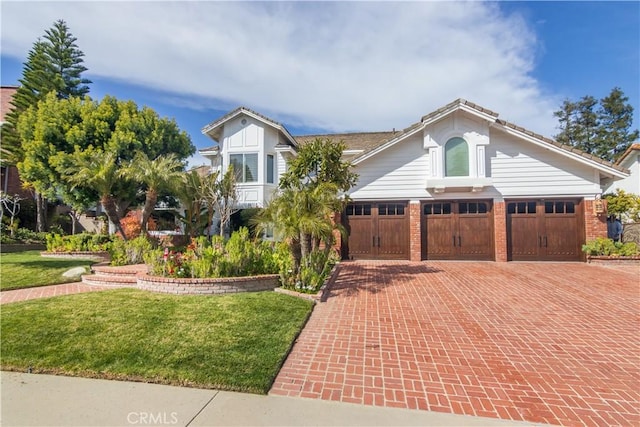 29515 Weeping Willow Dr, Agoura Hills, CA 91301 - view of front of house featuring decorative driveway, a front lawn, and brick siding