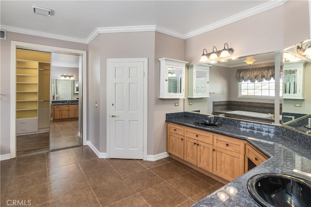 29515 Weeping Willow Dr, Agoura Hills, CA 91301 - bathroom featuring ornamental molding, vanity, baseboards, a bath, and tile patterned flooring