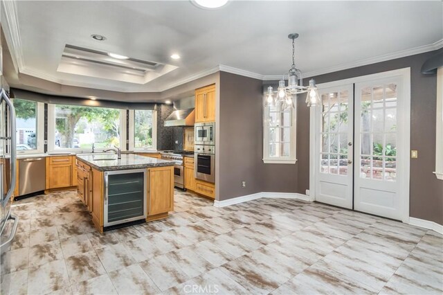 29515 Weeping Willow Dr, Agoura Hills, CA 91301 - kitchen with wine cooler, stainless steel appliances, ornamental molding, wall chimney range hood, and dark stone countertops