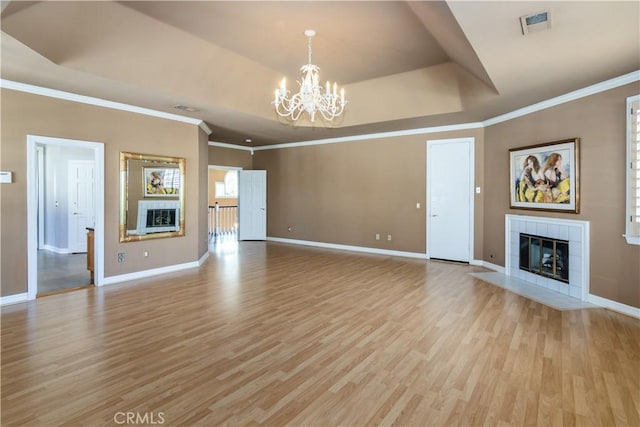 29515 Weeping Willow Dr, Agoura Hills, CA 91301 - unfurnished living room with a fireplace, a chandelier, light wood-style flooring, baseboards, and crown molding