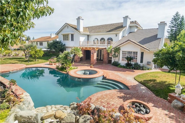 29515 Weeping Willow Dr, Agoura Hills, CA 91301 - back of property with a balcony, stucco siding, a lawn, and a patio area