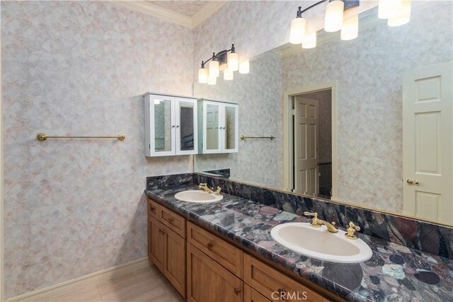 29515 Weeping Willow Dr, Agoura Hills, CA 91301 - bathroom featuring ornamental molding, double vanity, and baseboards